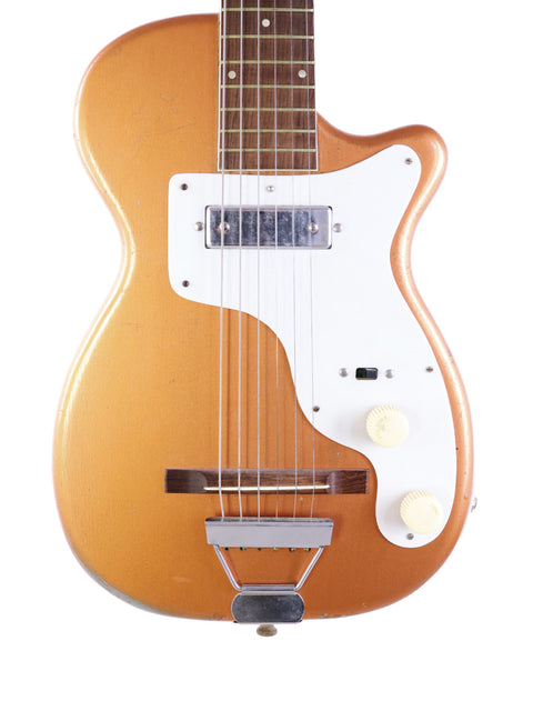 Vintage 1955 Harmony H44 Stratotone guitar in gold with a white pickup, highlighting its classic style and craftsmanship.