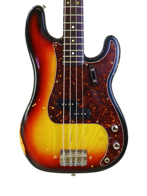 Vintage 1972 Fender Precision Bass guitar with a striking sunburst finish, highlighting its classic craftsmanship.