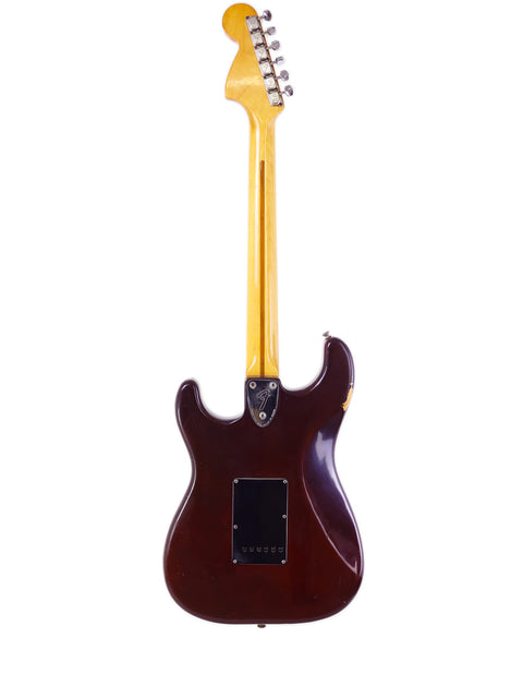 Vintage 1979 Fender Stratocaster guitar with a brown wooden body and neck, showcasing classic design and craftsmanship.