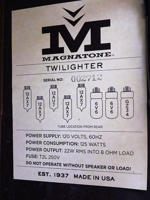 Wall-mounted sign stating "Magnatone Twilight," featuring the 2021 Magnatone Twilighter 1x12 Combo amplifier.