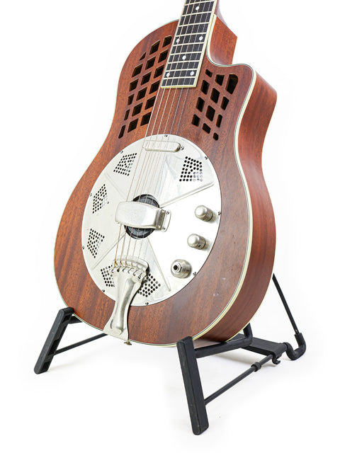 Wooden-bodied National ResoRocket WB Steel guitar on a metal stand, crafted in the USA, from the year 2016.