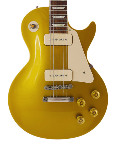 Yellow electric guitar featuring a white pickguard, representing the Gibson Custom Historic VOS LPR-6 1956 Reissue Gold Top, USA 2014.