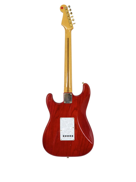 striking red Fender MIJ '57 Style Stratocaster guitar set against a white backdrop, highlighting its classic features.