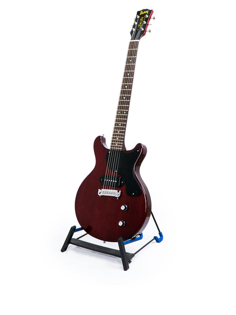 vibrant red guitar, the Burny Les Paul Jr from the 1980s, elegantly positioned on a stand against a pure white background.