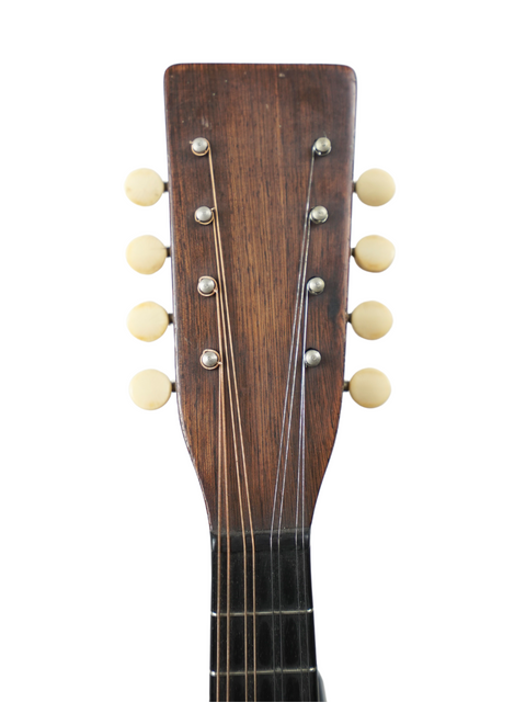 1930s Gibson D-18B guitar in its original hard case, next to a 1924 USA-made Martin AK Mandolin, showcasing vintage charm.