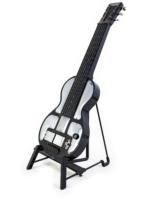 1930s Rickenbacher Electro B-6 Lap Steel guitar resting on a stand, set against a bright white background.