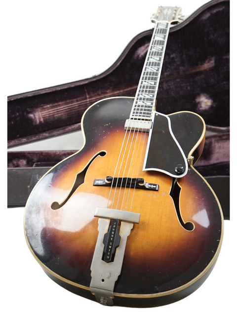 1966 vintage Gibson Johnny Smith guitar with a protective case, linked to Ike Isaacs and George Benson.