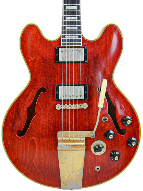 1967 vintage Gibson ES-355 Stereo guitar in vibrant red, complemented by a stylish white pickguard, ideal for collectors.