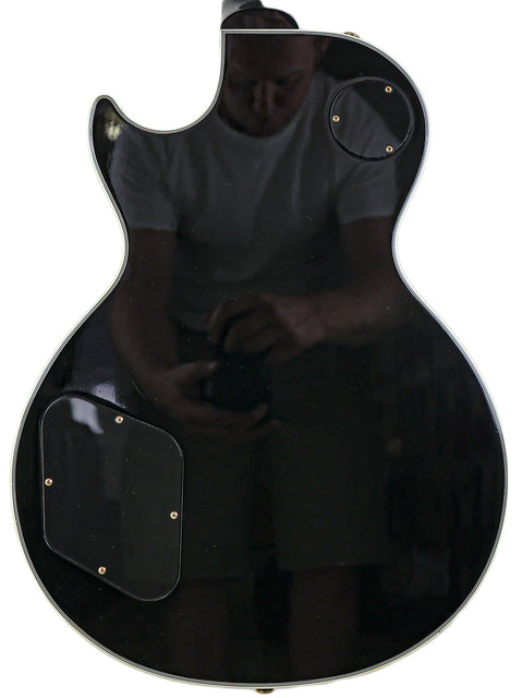 2010 Gibson Custom Shop Les Paul Custom guitar, reflecting his enthusiasm for playing.