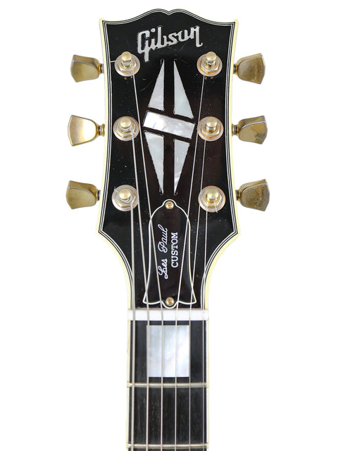2010 Gibson Les Paul Custom Shop in black, highlighting its elegant curves and high-quality finish, perfect for any guitarist.