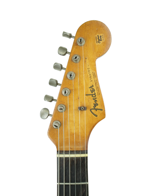 A 1961 Fender Stratocaster in Fiesta Red, previously owned by Phil Emmanuel, showcasing its classic design and craftsmanship.