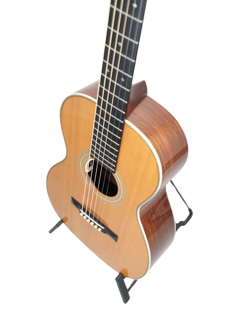 A 2011 USA-made Martin 0-28VS guitar resting on a stand, set against a plain white background.
