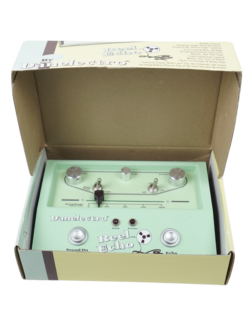 A Danelectro Reel Echo effects pedal in mint green color, displayed in its open box.