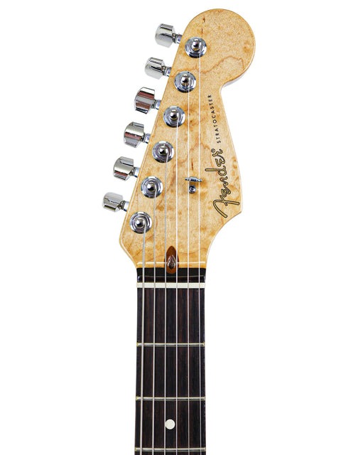 A Fender Custom Shop American Classic Stratocaster guitar with a black headstock against a clean white background.
