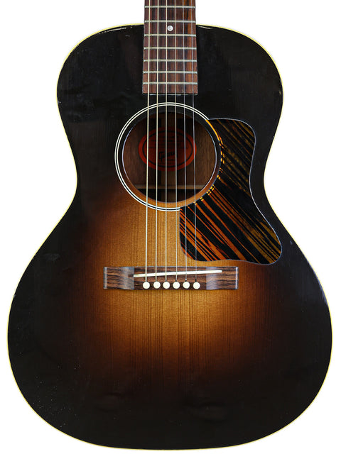 A Gibson J-60 acoustic guitar, showcasing its vintage design and craftsmanship, made in the USA in 2014.