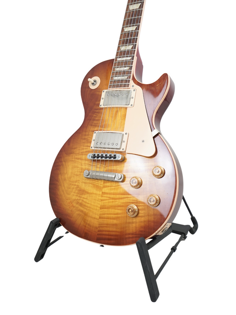 A Gibson Les Paul Standard 60s Slim Taper Neck guitar displayed on a stand, highlighting its classic features from 2005.