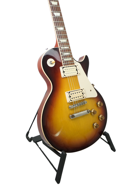 A Gibson electric guitar, model LPR-8 '58 Les Paul Standard R/I, elegantly positioned on a stand, highlighting its craftsmanship.