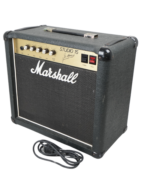 A Marshall 4001 Studio 15 Combo amp (UK, 1987) with visible power and audio cords, highlighting its retro aesthetic.