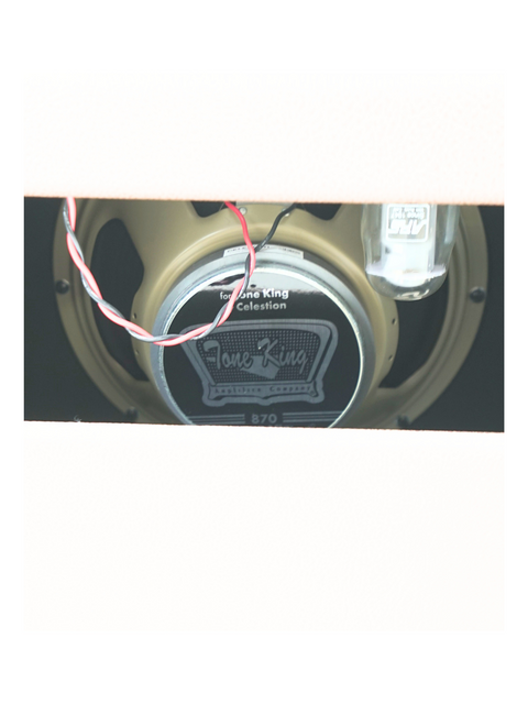 A Tone King Gremlin 1 x 12" combo speaker with wires, emphasizing its classic look and sound quality.