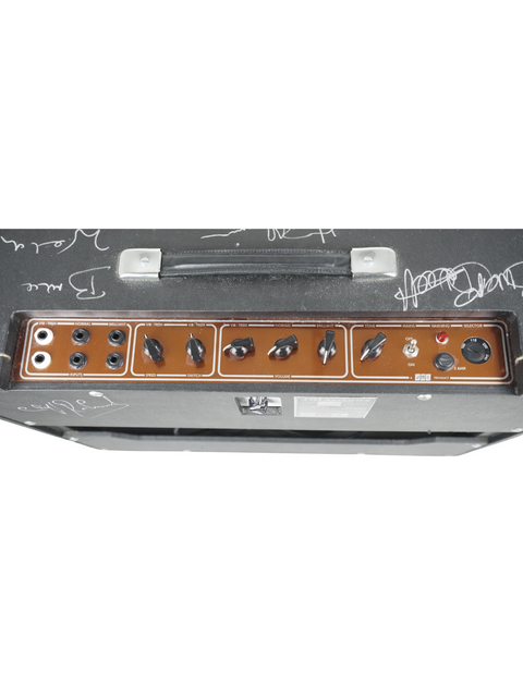 A black and brown amplifier featuring a guitar on top, highlighting the JMI-30 Shadows Anniversary Tour signed edition from the UK, 2009.