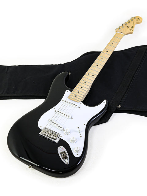 A black electric guitar, the Fender Eric Clapton "Blackie" Stratocaster, stored in a protective carrying case, USA 2022.