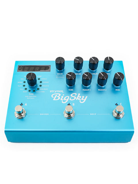 A blue Strymon BigSky multi-reverb pedal featuring four adjustable knobs for sound customization.