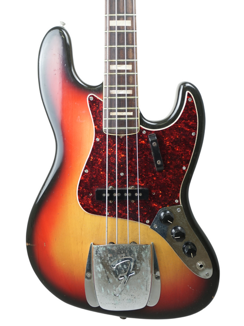 A classic 1972 Fender Jazz Bass guitar in sunburst finish, highlighting its vintage charm and iconic style.