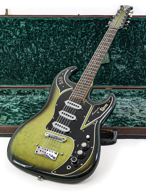 A classic green 1964 Burns Double Six 12-string guitar with its case on the floor, ready for a jam session.