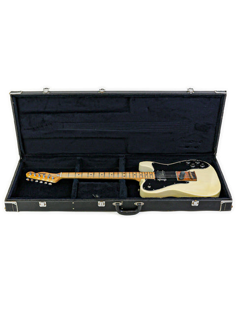 A classic white Fender Telecaster Custom guitar, model year 1978, securely housed in a black case.