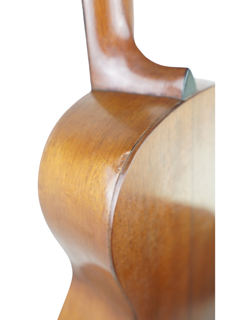 A close-up of the wooden back of a 1928 Martin 2-17 Flat Top guitar, emphasizing its vintage craftsmanship.