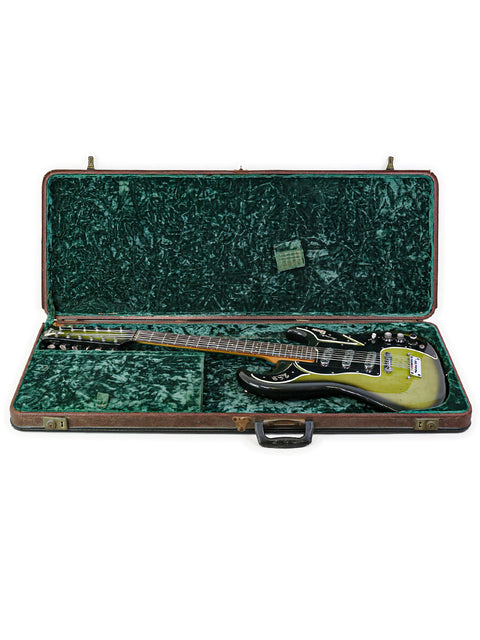 A green guitar case reveals a classic 1964 Burns Double Six 12-string guitar, perfectly matching its vibrant exterior.
