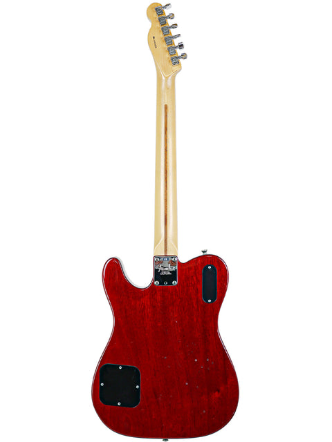 A red electric guitar, the Fender Tele-Sonic from 2001, featuring a wooden body, exemplifying classic craftsmanship.
