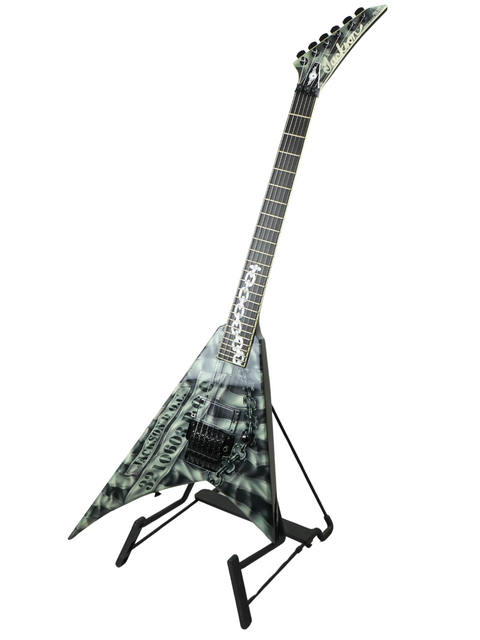 A striking guitar with a sleek black body and vibrant green headstock, showcasing the 2006 Jackson Custom Shop Randy Rhoads RR1.