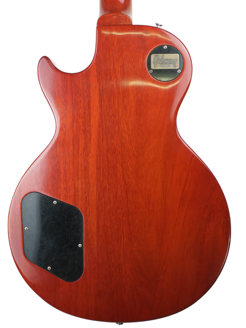 A striking red electric guitar featuring a black pickguard, the Gibson Custom LPR-8 '58 Les Paul Standard R/I from 2012.