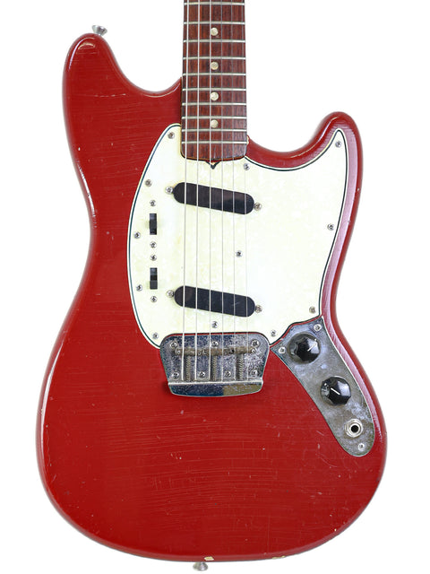 A striking red electric guitar, the 1966 Fender Musicmaster II, equipped with a white pickup, perfect for music enthusiasts.