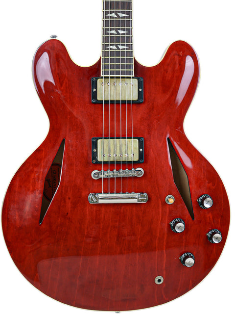 A striking red guitar featuring a black body and white pickguard, the Gibson Custom Shop Trini Lopez, USA 2009 model.