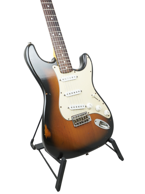 A stunning Fender Custom Shop Stratocaster with a moc sunburst finish, highlighting its relic design from the USA, 2009.
