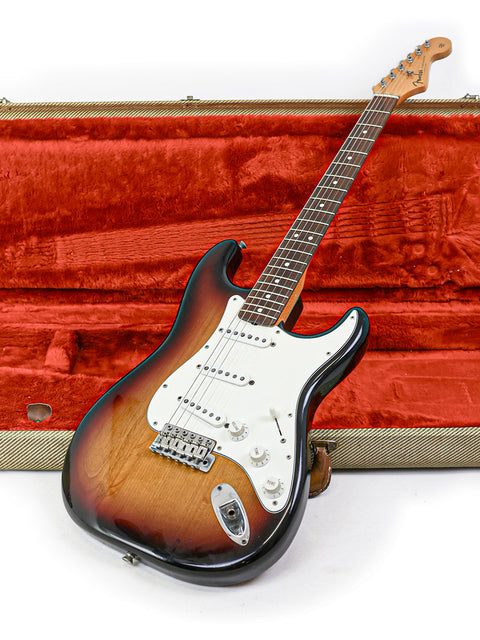 A vintage 1982 Fender AVRI ‘62 Stratocaster guitar inside a protective case, ready for its next musical adventure.