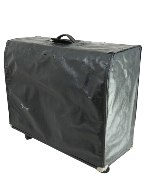 A vintage black suitcase with a white cover, capturing the essence of a 1974 Fender Twin Reverb amplifier.