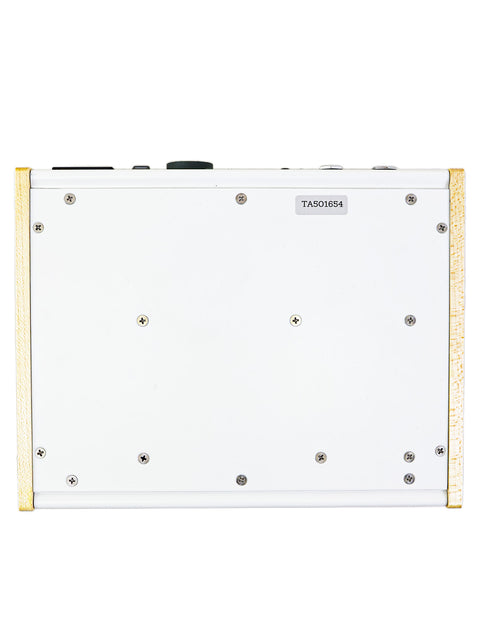 A white box with gold accents and a small hole, identified as 'Milkman The Amp' from the USA.