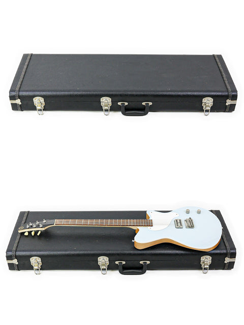  A white guitar case with a black handle, branded 'Koll Troubadour - USA 2013', showcasing a modern and sophisticated design.

