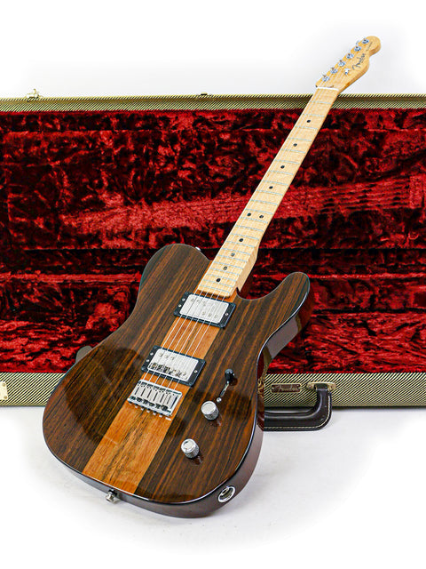A wooden electric guitar leaning against a red velvet-lined case.