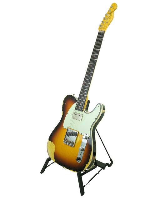 A yellow-bodied Fender Custom Shop Telecaster guitar with a black neck, showcasing its aged relic finish from 2017.
