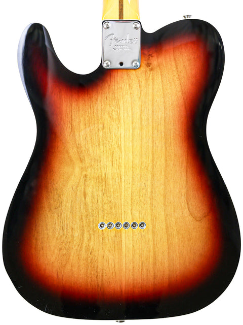 An electric guitar with a striking sunburst finish, the Txxx Custom Thinline '72 Partscaster, crafted in 2022.