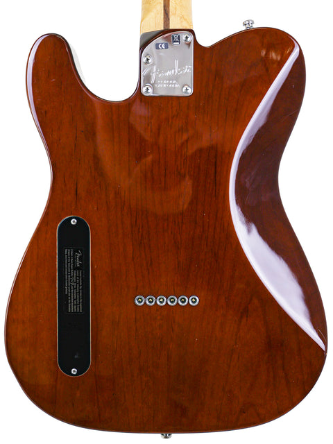 Back view of a brown electric guitar with a glossy finish and metal details.