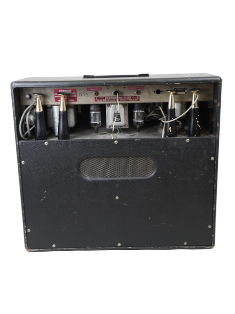 Black-cased Goldentone Reverbmaster Model 1755 amplifier from 1966, with visible wires, representing classic audio technology.