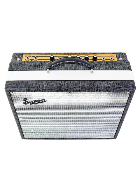 Black and white amplifier featuring a stylish white cover, the Supro Black Magick 1695T 25W Combo from 2015.
