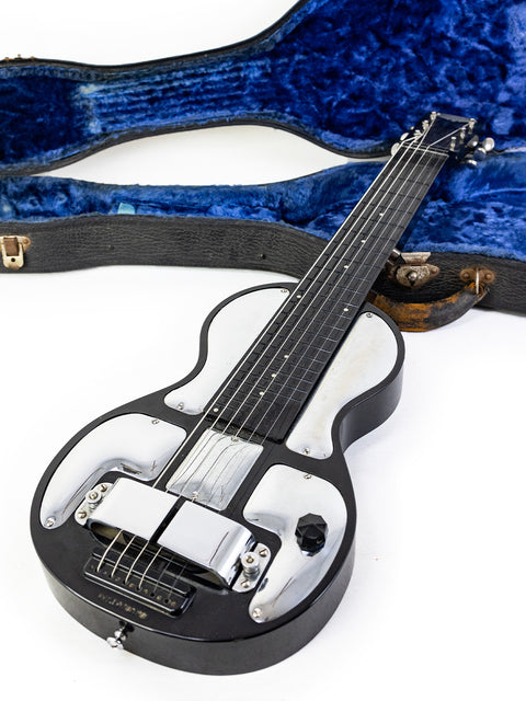 Black and white vintage Rickenbacher Electro B-6 Lap Steel guitar from the 1930s, housed in a stylish blue case.