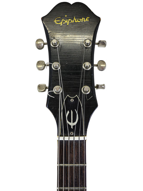 Black headstock of a 1965 vintage Epiphone Casino electric guitar, showcasing its classic design.