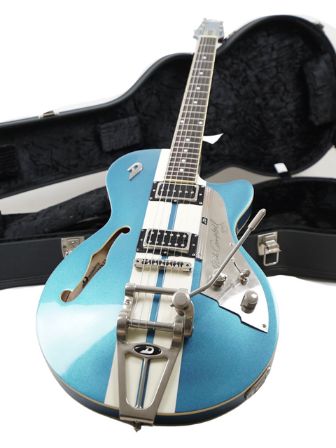 Blue electric guitar with silver hardware on a black case.